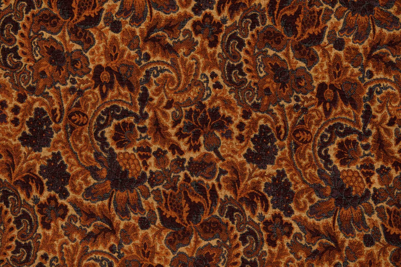 Burnished amber floral and paisley textile with rust and deep brown detailing