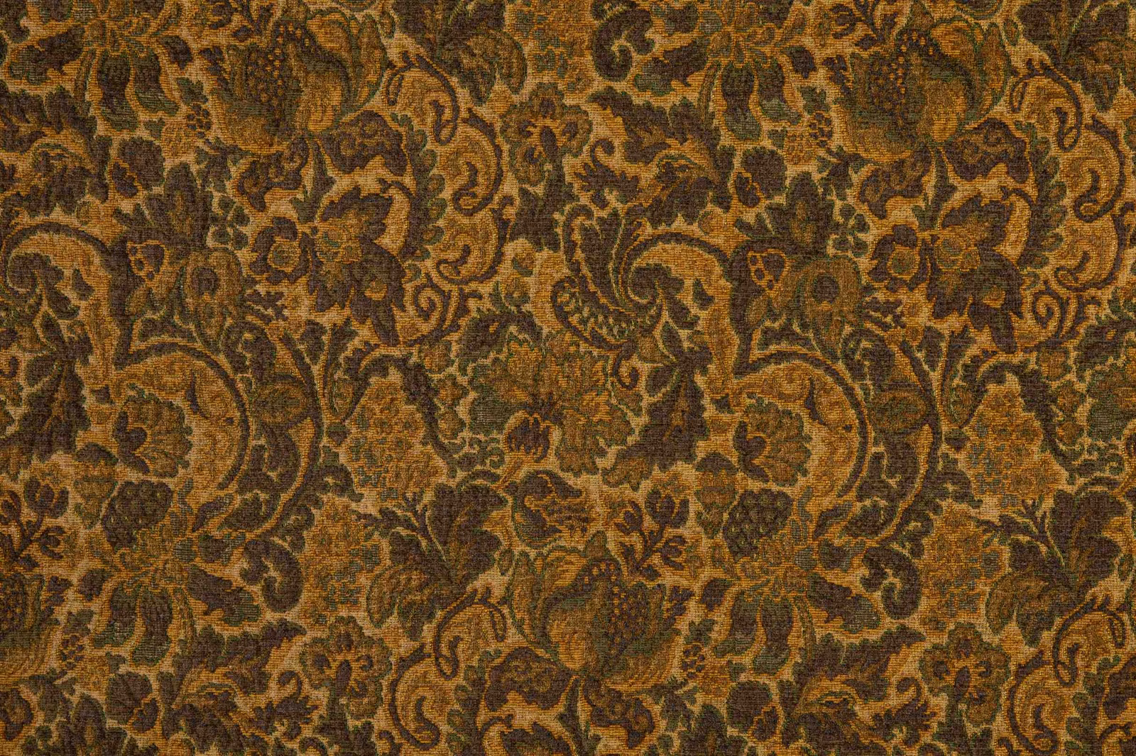 Warm bronze paisley and floral textile with dark brown outlines and textured weave