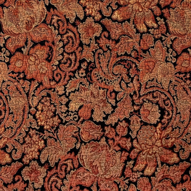 Rust and coral paisley florals woven over a black ground