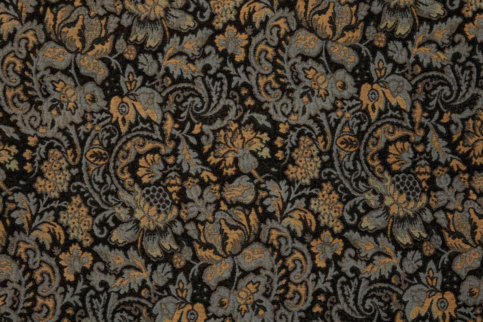 Onyx textile with dense charcoal florals, blue-grey foliage and muted gold details