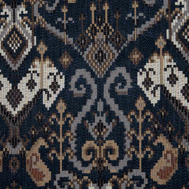Deep ink-blue woven ground with ivory diamonds and rust ornamental motifs