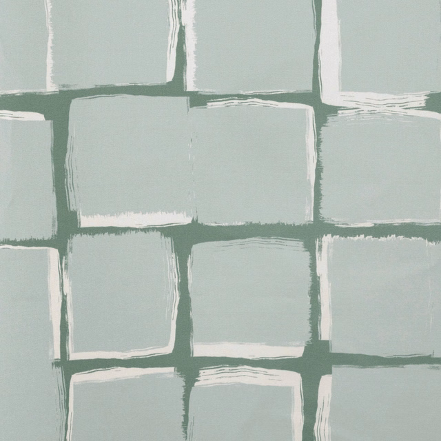 Pale celadon fabric with irregular hand-painted-looking blocks and deep green grid lines