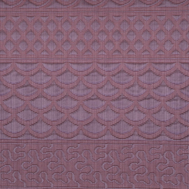 Dusty lilac woven textile with raised scalloped bands and linked geometric motifs