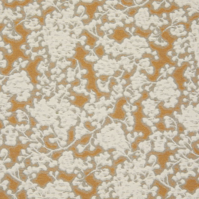 Muted ochre-gold textile with dense ivory organic motifs and a soft woven surface