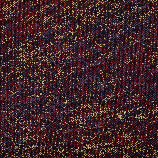 Dark fig-plum textile with burgundy depth and scattered ochre, teal, and gold flecks