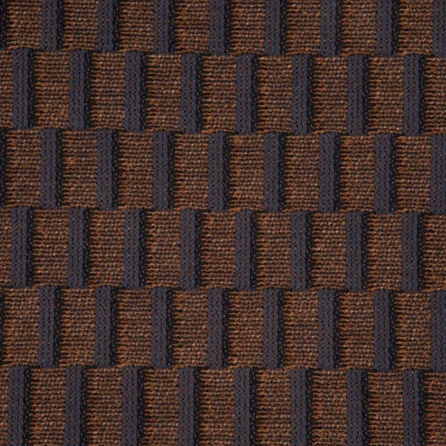 Charcoal and tobacco-brown woven blocks with a raised, tactile surface