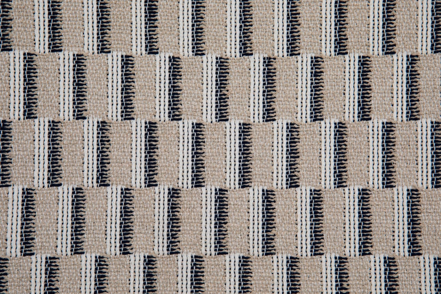 Oatmeal and cream woven ground with staggered charcoal vertical marks