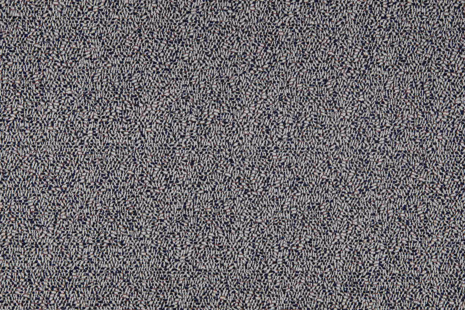 Deep ink-blue textile with dense ivory-grey broken flecks and a softly nubby weave