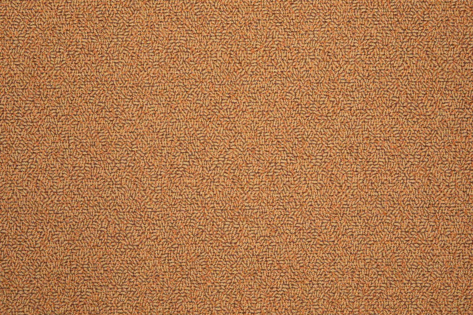 Close-up of warm terracotta woven fabric with dense broken-dash texture