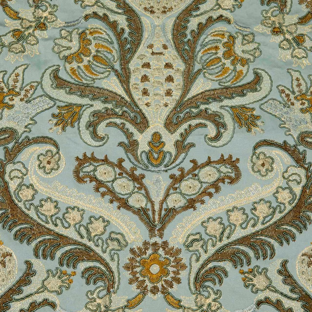 Celadon woven fabric with symmetrical paisley, floral and muted gold botanical motifs