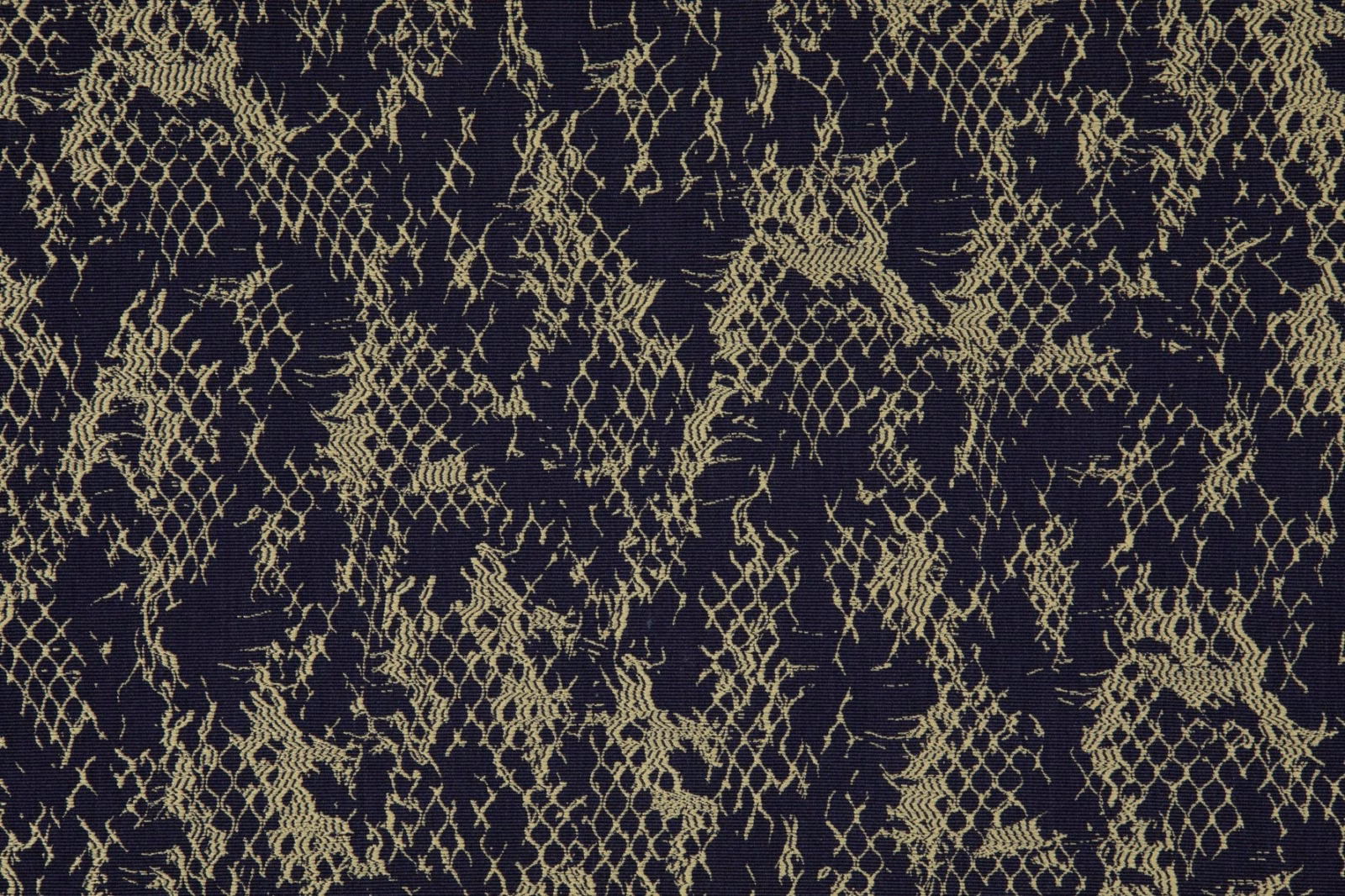 Dark raisin woven fabric with pale-gold distressed lattice and branching tracery