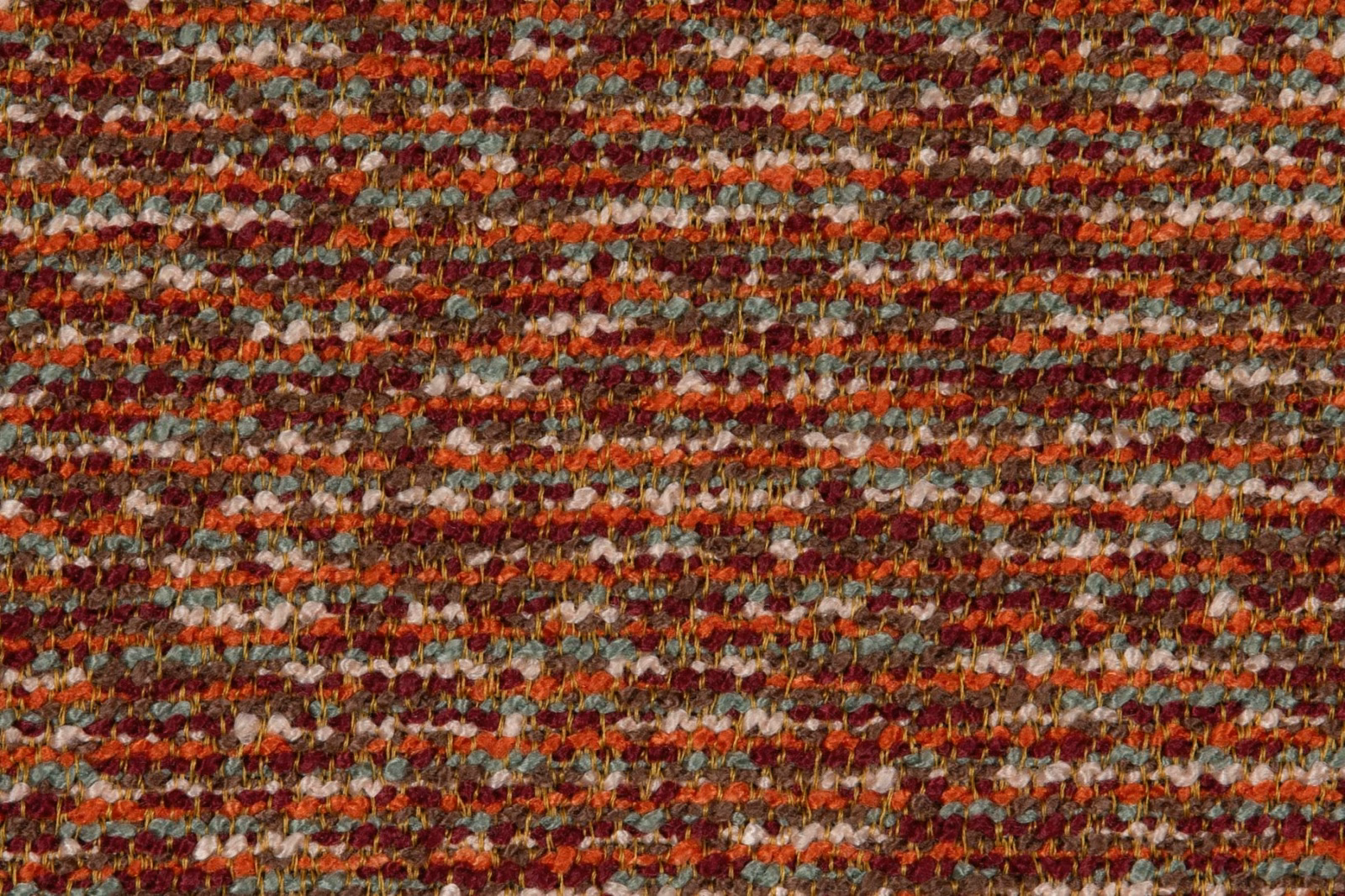 Close-up of rust and red horizontal weave with cream and blue-green flecks