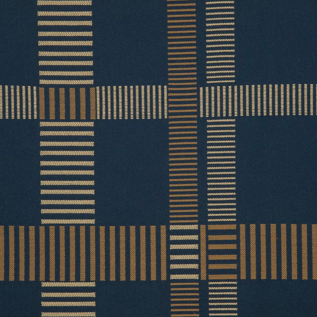 Deep marine textile with tan broken stripes forming an offset geometric grid