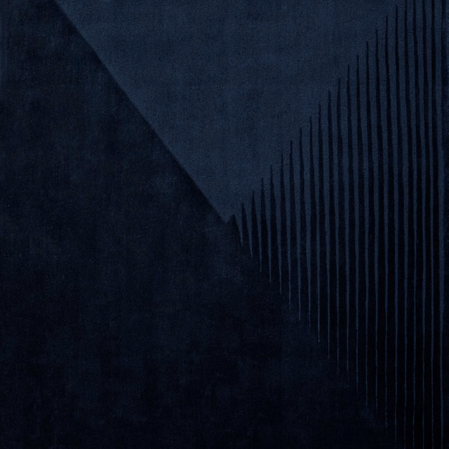Blue-black anthracite textile with a shadowed diagonal and fine vertical lines