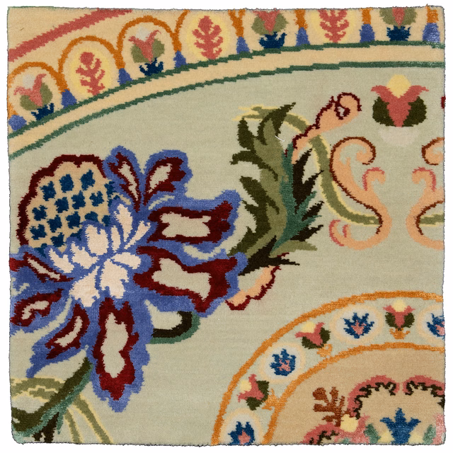 Pastel sage floral textile swatch with blue, coral, olive and burgundy ornamental motifs