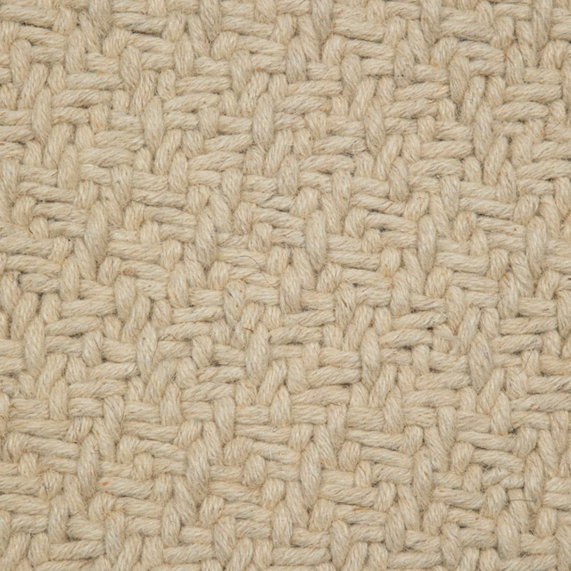 Close view of warm oatmeal-beige chunky basket weave with cream fibres