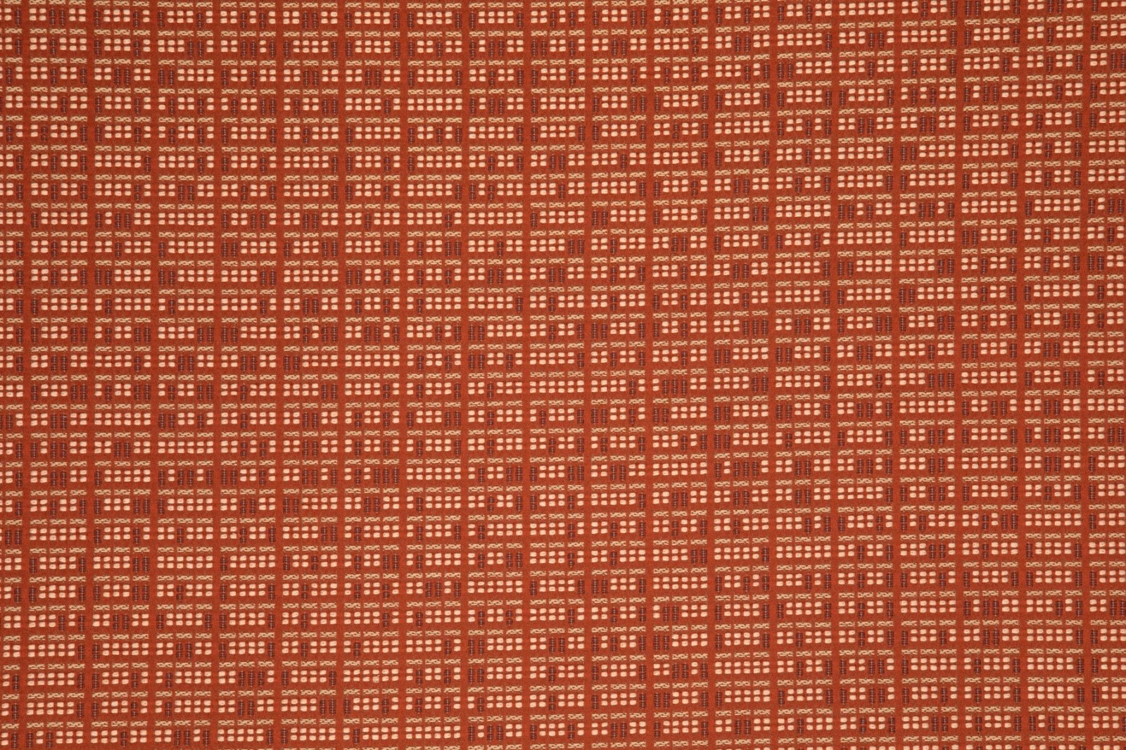 Brick-red woven fabric with dense pale broken rectangular grid pattern