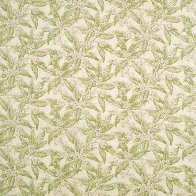 Cream fabric with pale apple-green leafy sprays and delicate botanical blossoms