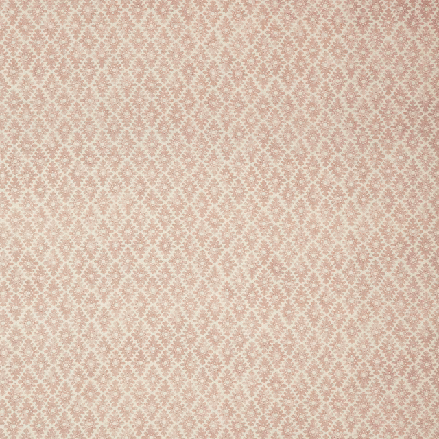 Soft blush-pink fabric with a dusty-rose small-scale repeating ornamental weave