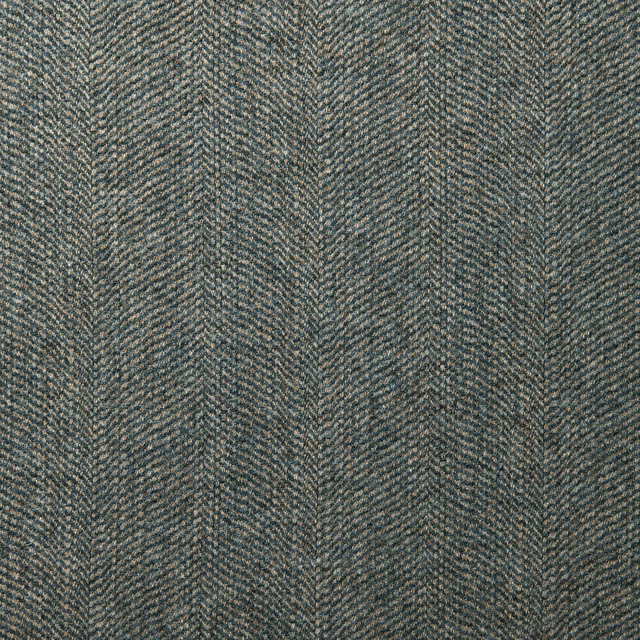 Close view of cool denim-blue wool with fine lilac-grey herringbone texture