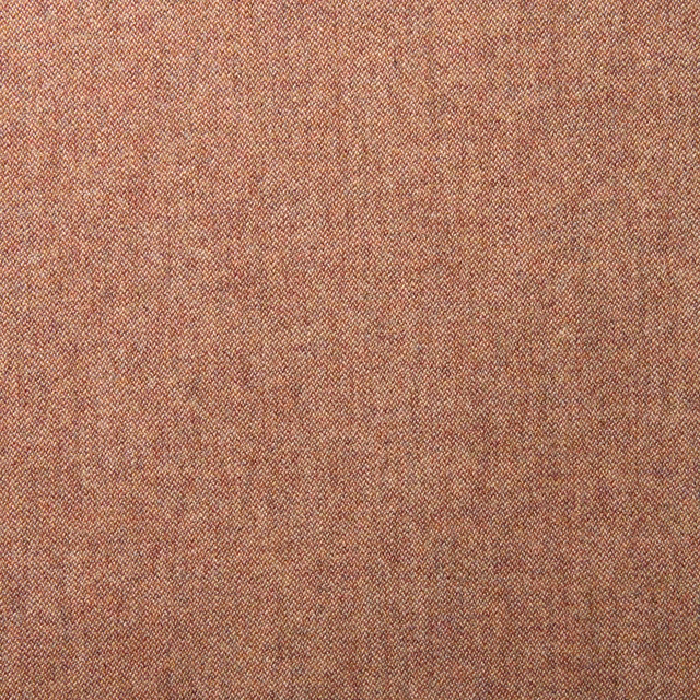 Close-up of warm brick-red wool with subtle russet flecks and fine woven texture