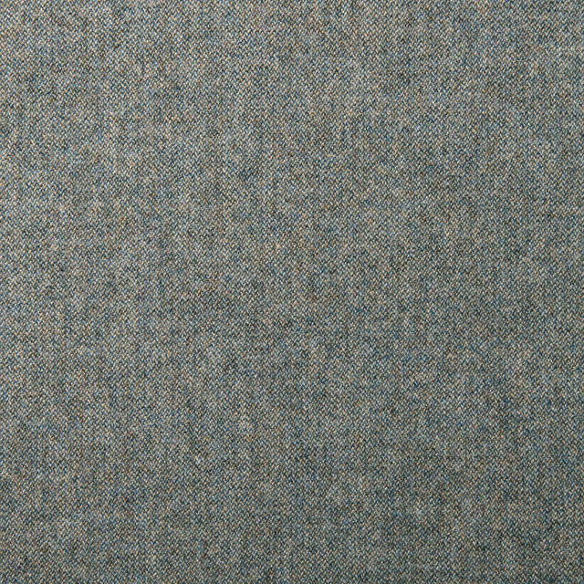 Close-up of muted denim blue wool weave with lilac and warm flecks