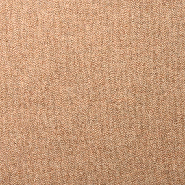 Close-up of pale ginger peach wool with a fine softly mottled plain weave