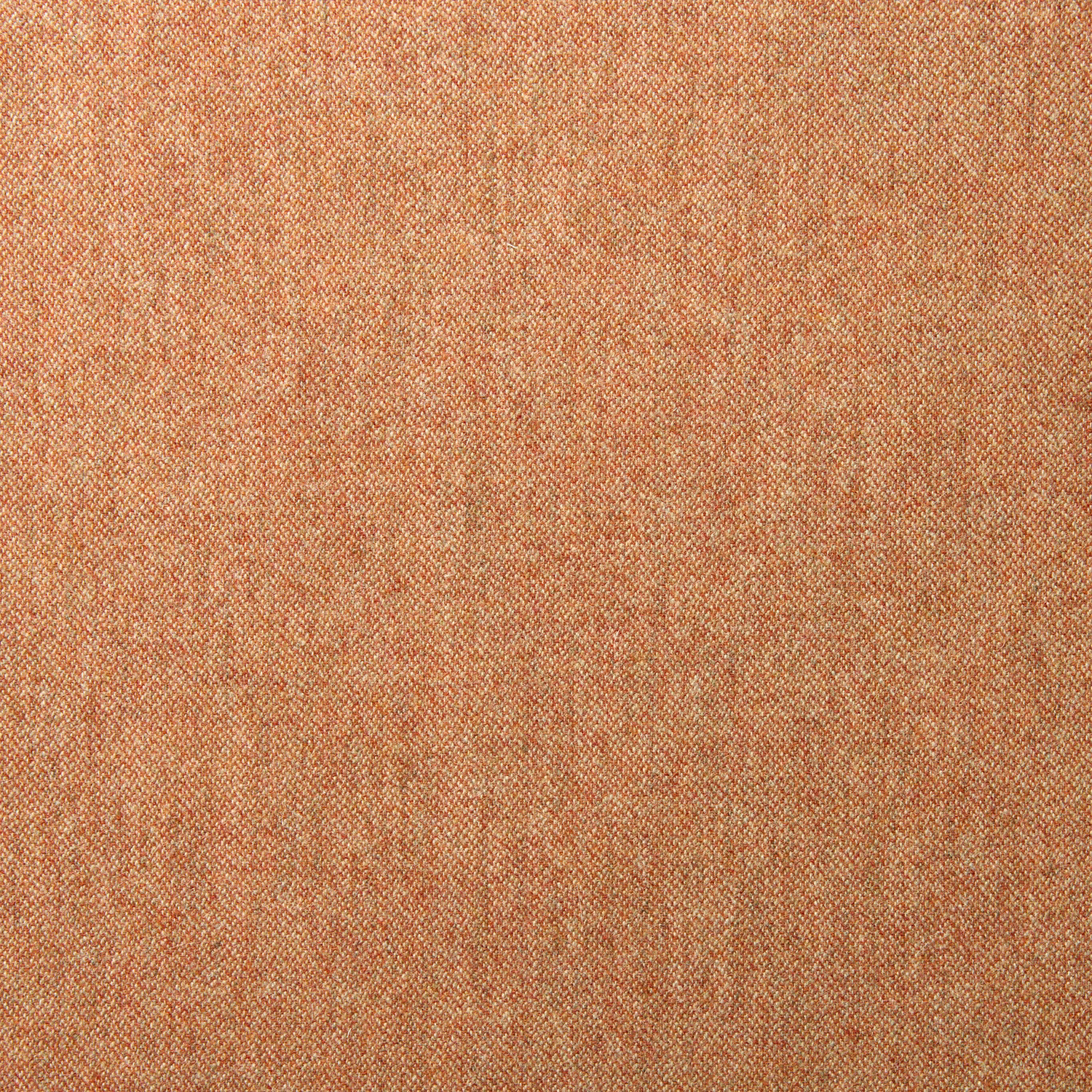 Close view of dusty coral-pink wool with fine mottled diagonal weave