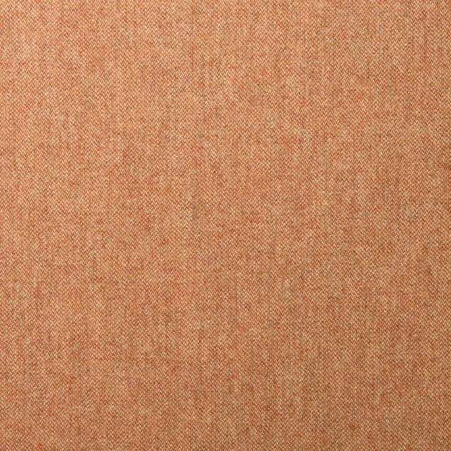 Close view of dusty coral-pink wool with fine mottled diagonal weave