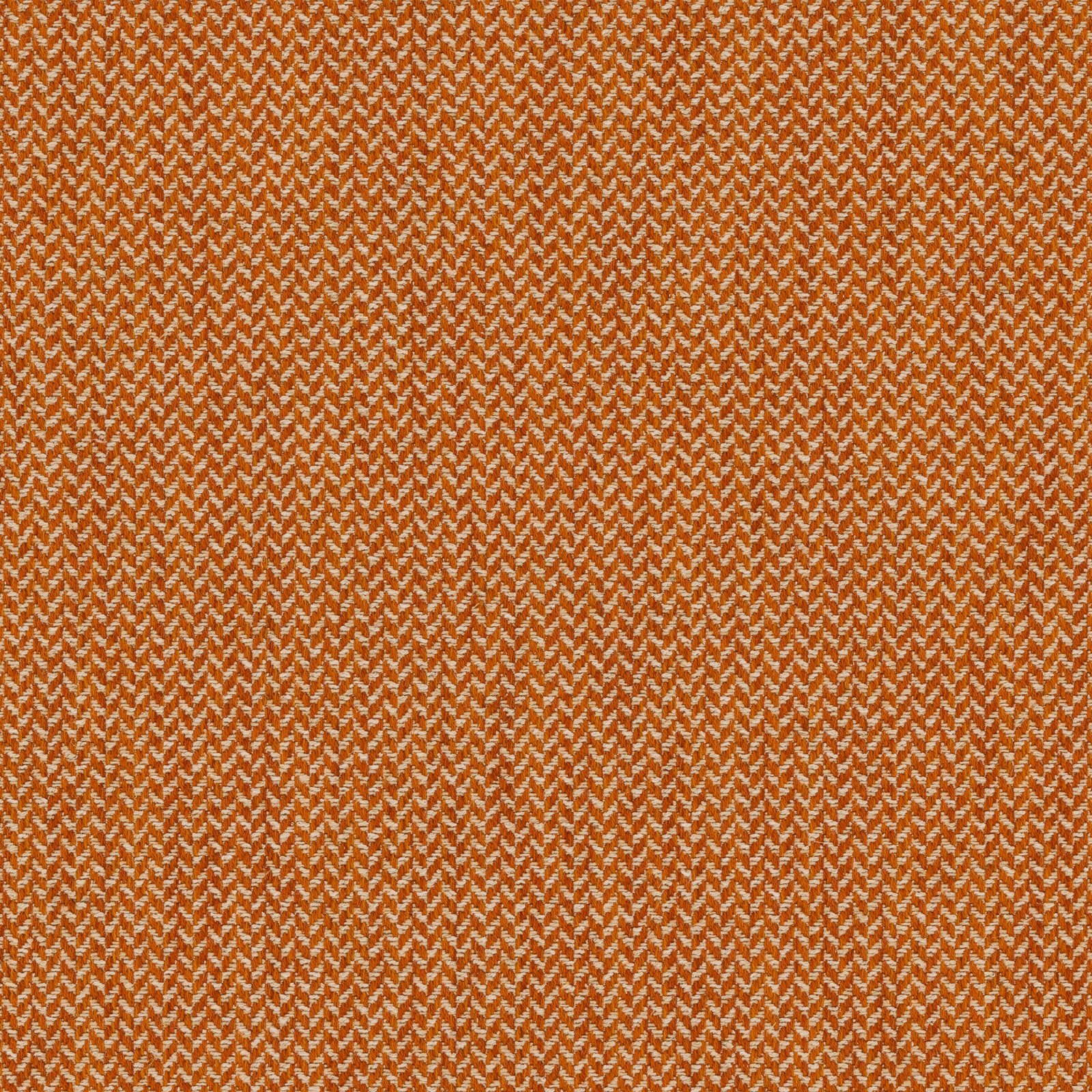 Close-up of warm mango-orange herringbone woven upholstery fabric