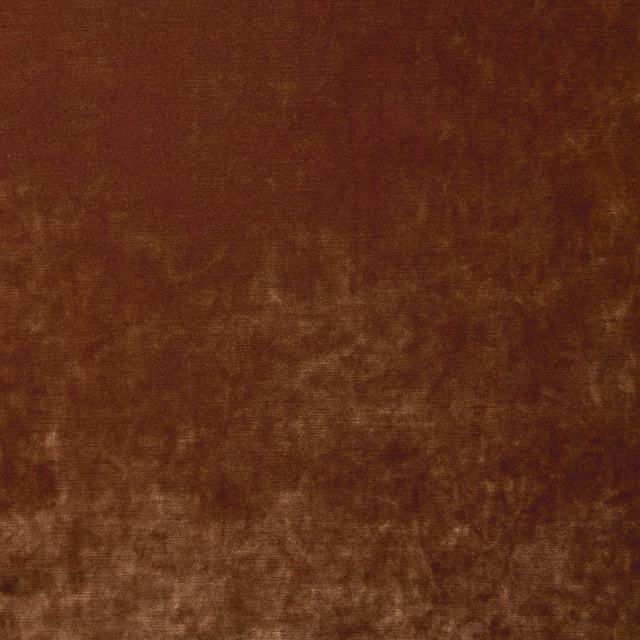 Warm brick-red velvet with smoky brown mottling and directional light-catching pile
