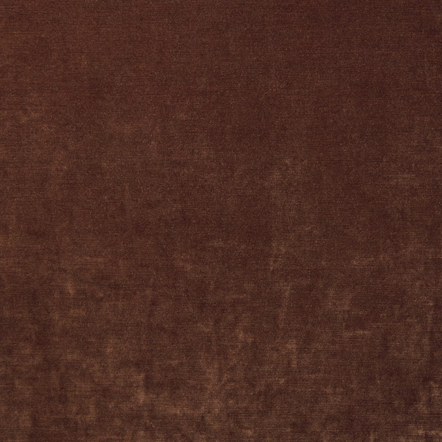 Close-up of warm russet brown velvet with softly mottled nap and subtle sheen