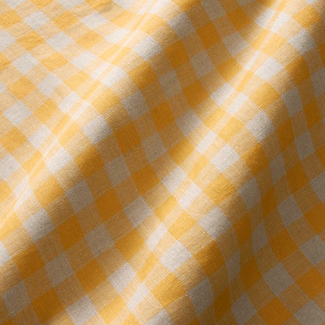 Mellow ochre, cream and warm grey linen check with visible slubbed texture