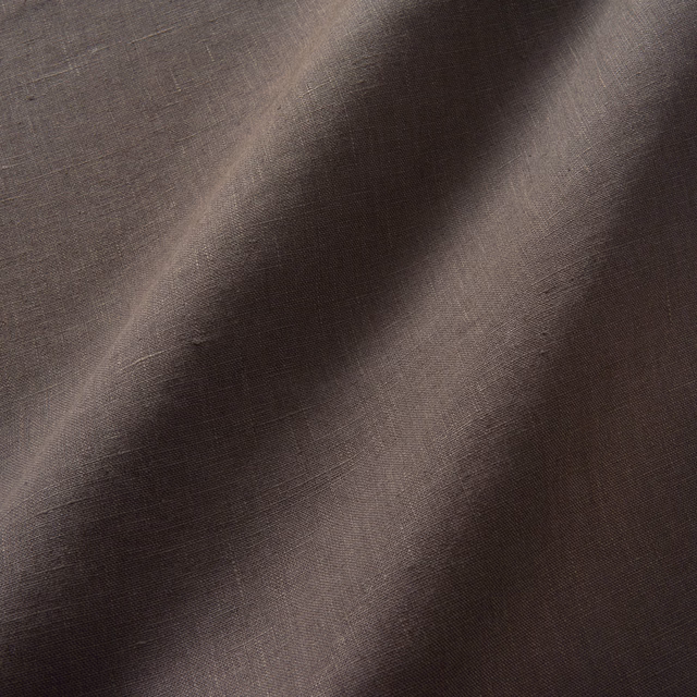 Close-up of dark chocolate-brown linen weave with softly shifting tonal highlights