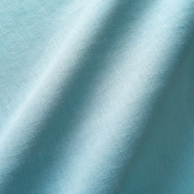 Cool duck egg linen with fine weave and softly shaded diagonal folds