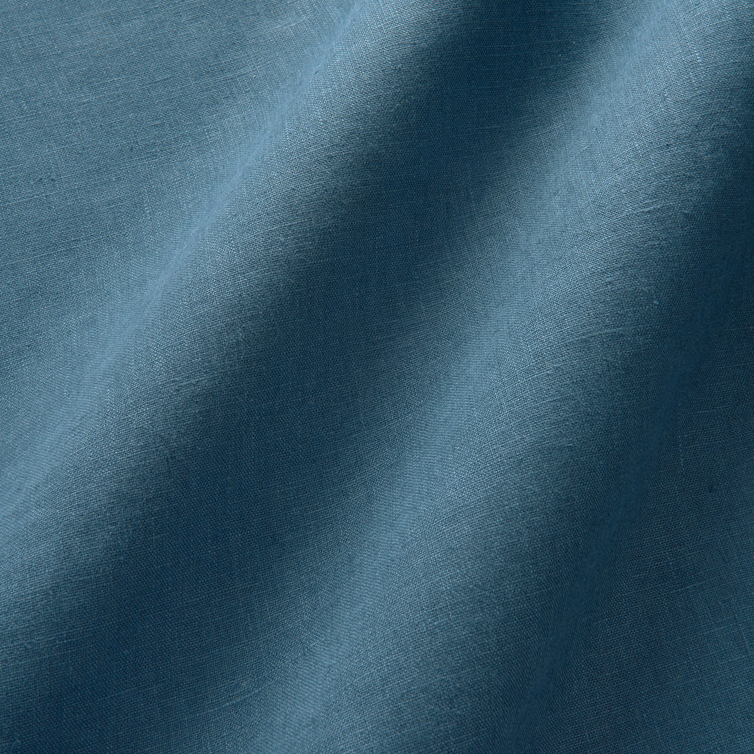 Deep ocean-blue linen with a fine slub weave and soft tonal shading