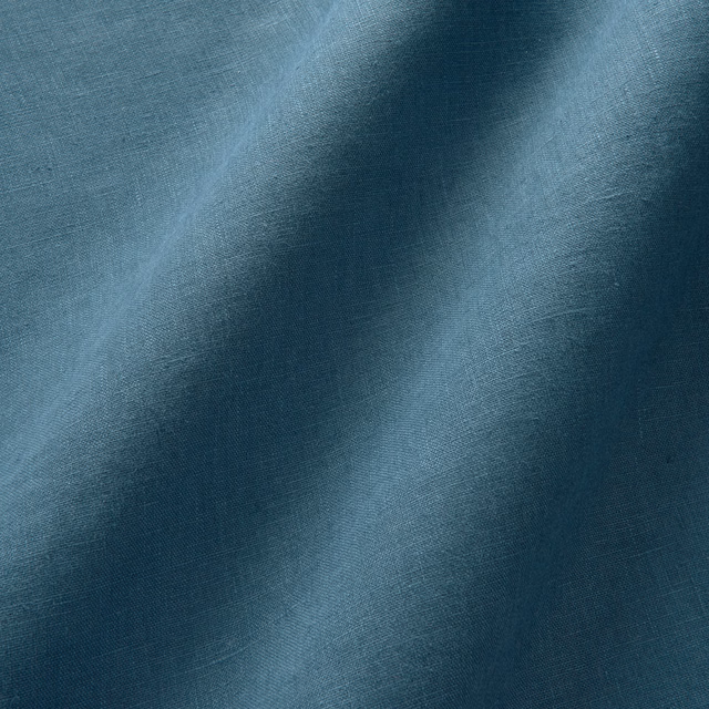 Deep ocean-blue linen with a fine slub weave and soft tonal shading