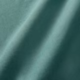 Sea-green plain linen showing fine weave and tonal folds from aqua to deep teal