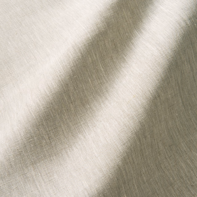 Close-up of pale pearl-grey fabric with a fine, softly tonal woven texture