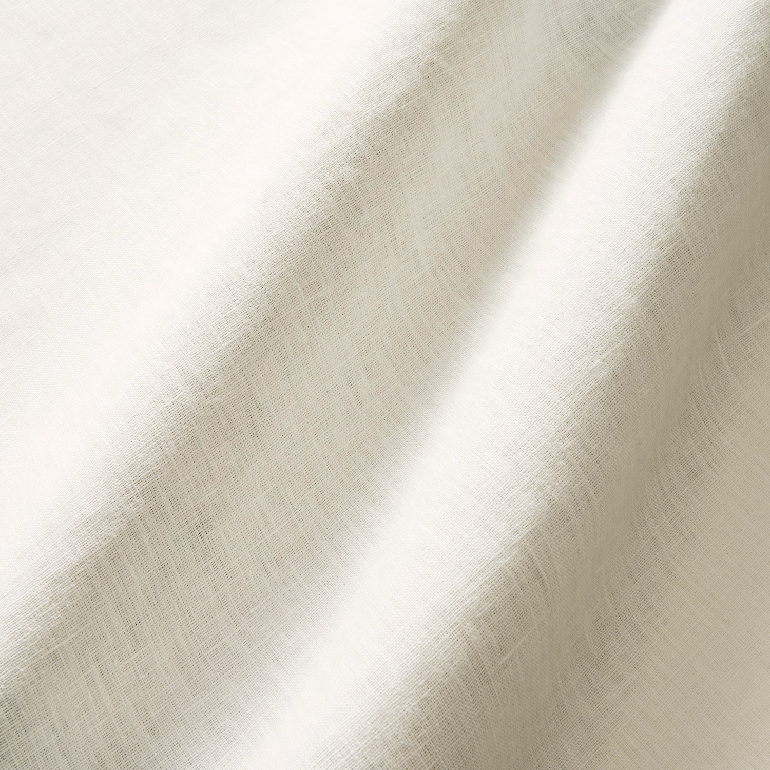 Pale greige woven swatch with fine crosshatch texture in soft folds