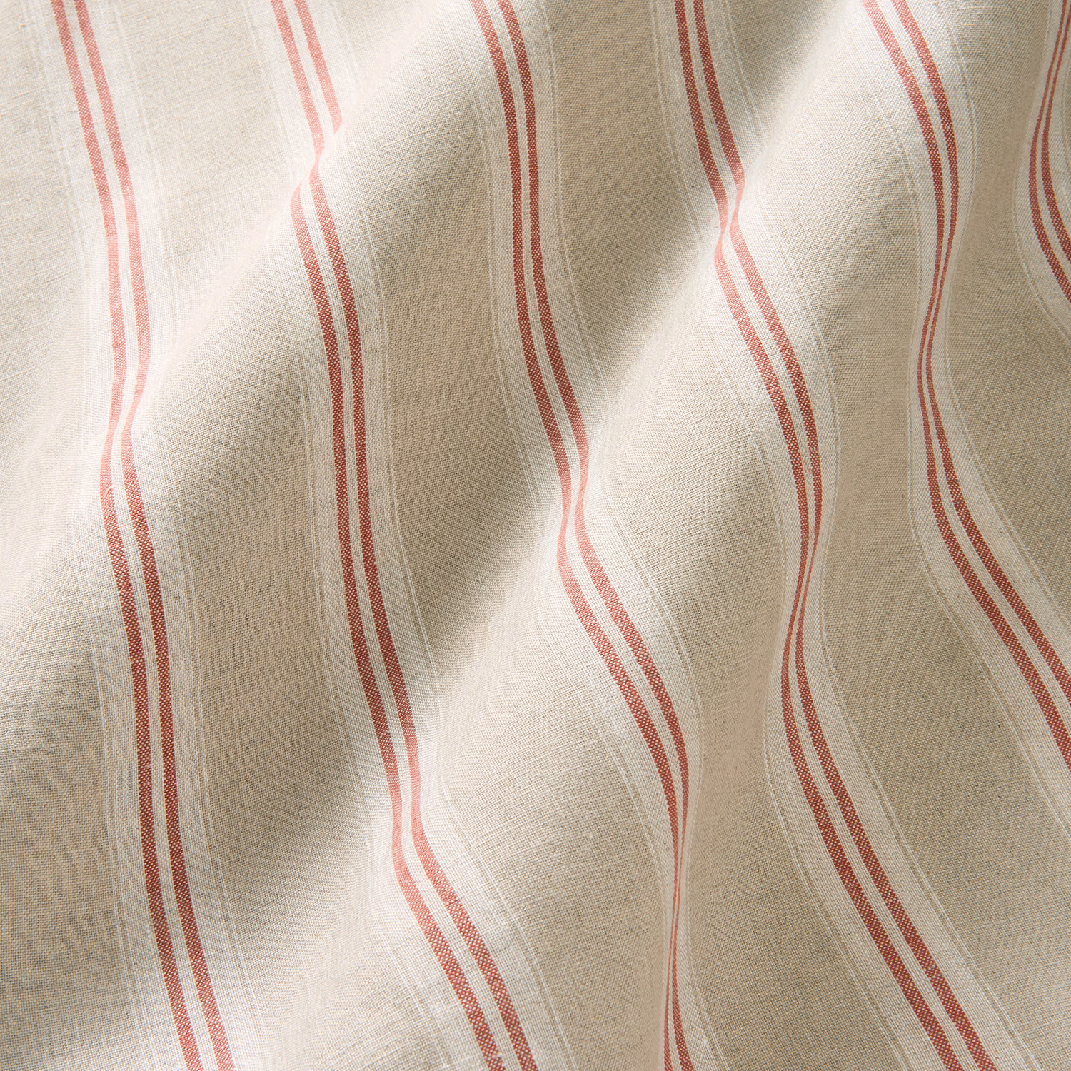 Warm natural linen with wavering cherry-red and blush vertical stripes