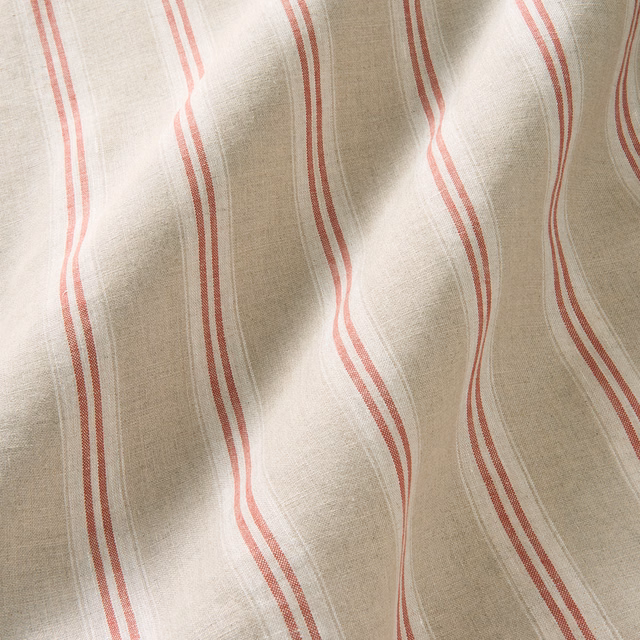 Warm natural linen with wavering cherry-red and blush vertical stripes