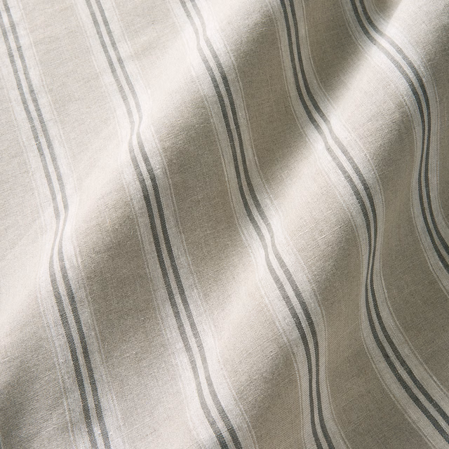 Dove-grey linen with wavering charcoal stripes and a softly slubbed weave