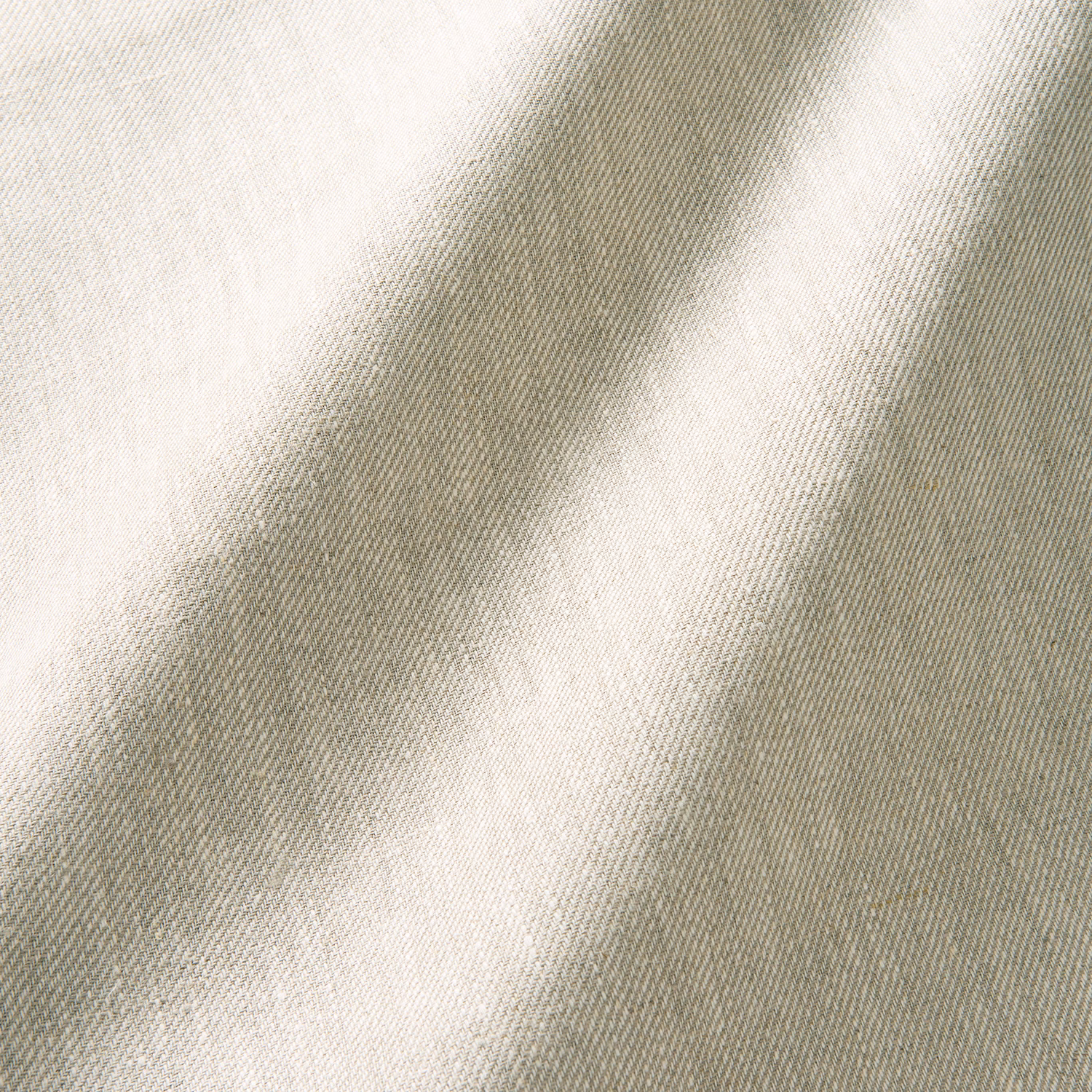 Warm oatmeal linen with fine diagonal twill and softly shifting cream-grey highlights