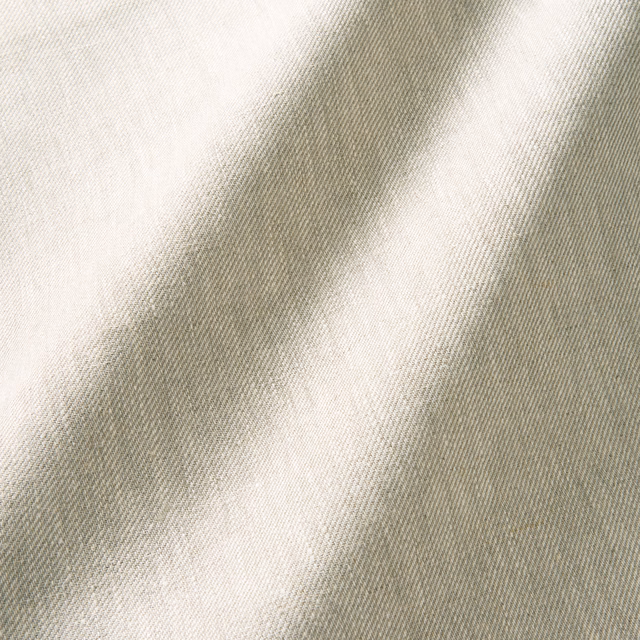 Warm oatmeal linen with fine diagonal twill and softly shifting cream-grey highlights