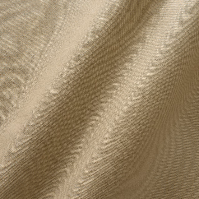 Warm bisque linen with a fine plain weave and softly shaded folds
