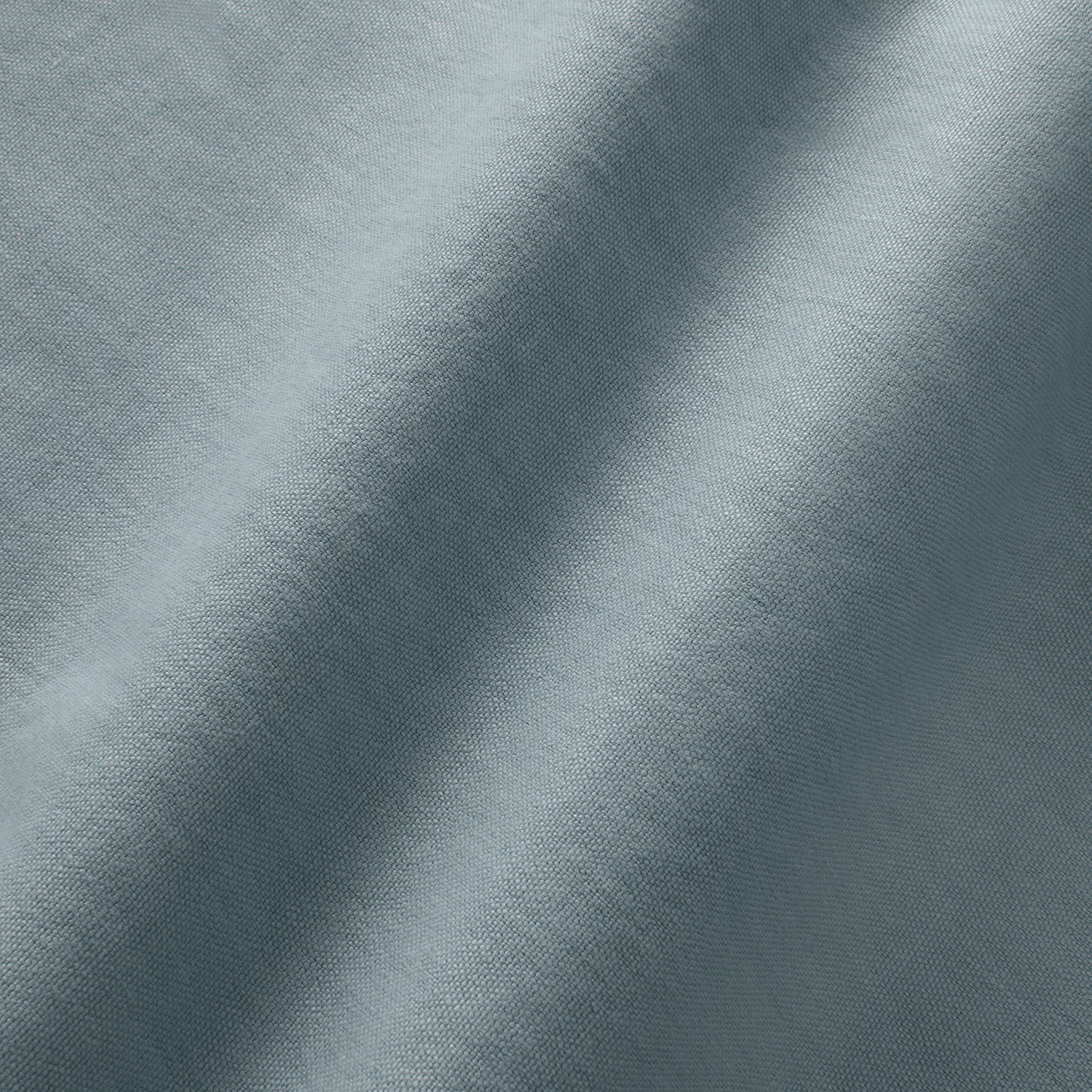 Close-up of cool cerulean blue-grey linen with a fine mottled plain weave
