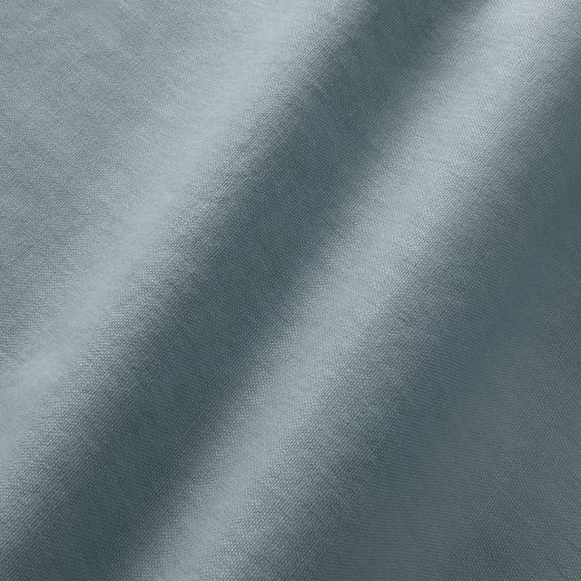 Close-up of cool cerulean blue-grey linen with a fine mottled plain weave