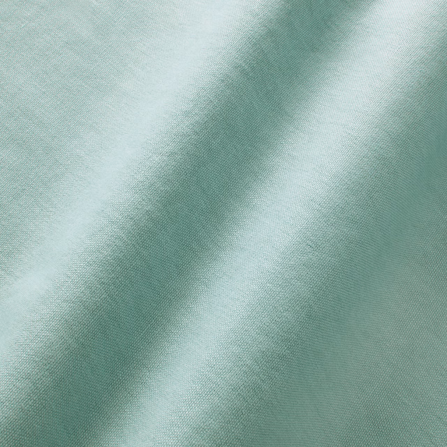 Pale ice-blue linen with a fine plain weave and softly shifting fold highlights