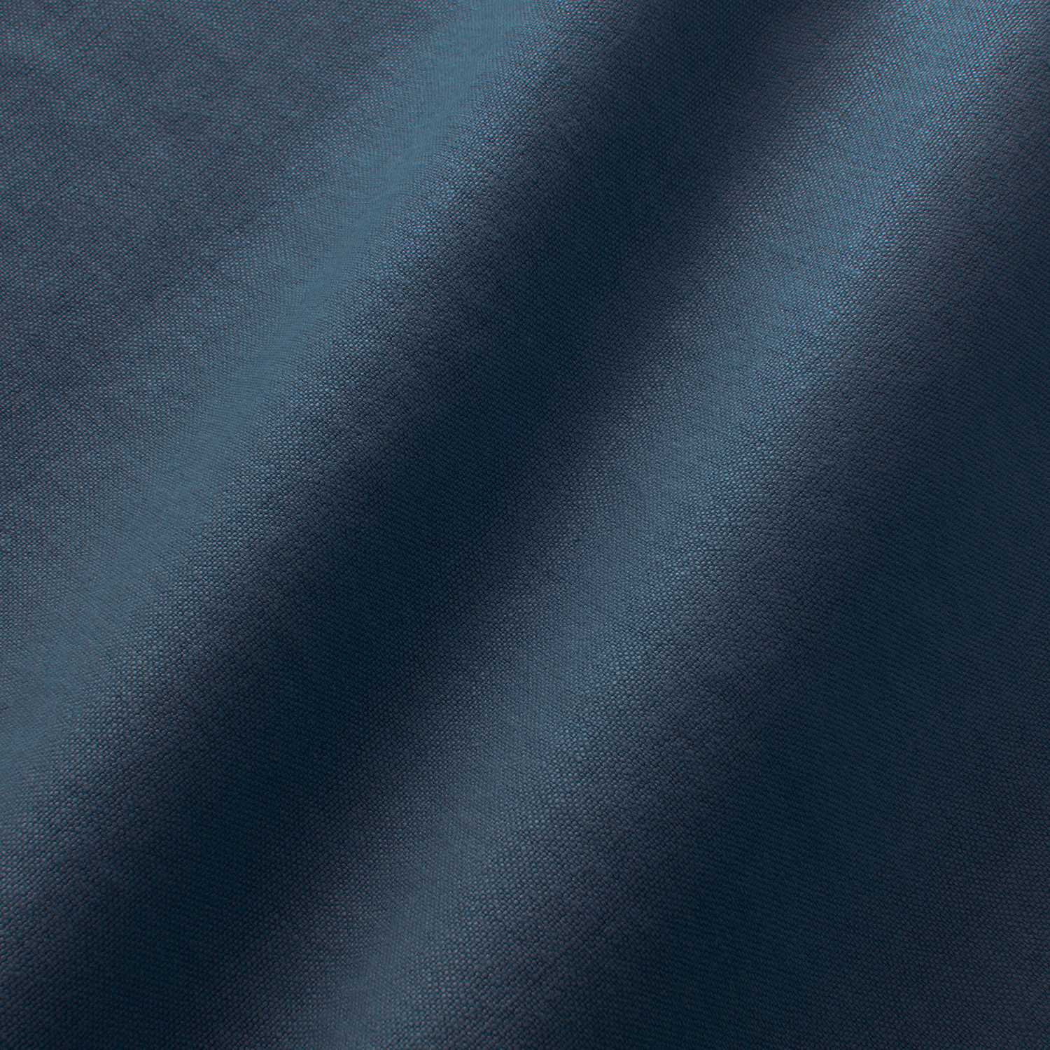 Deep indigo blue linen with fine plain weave and softly shaded folded texture